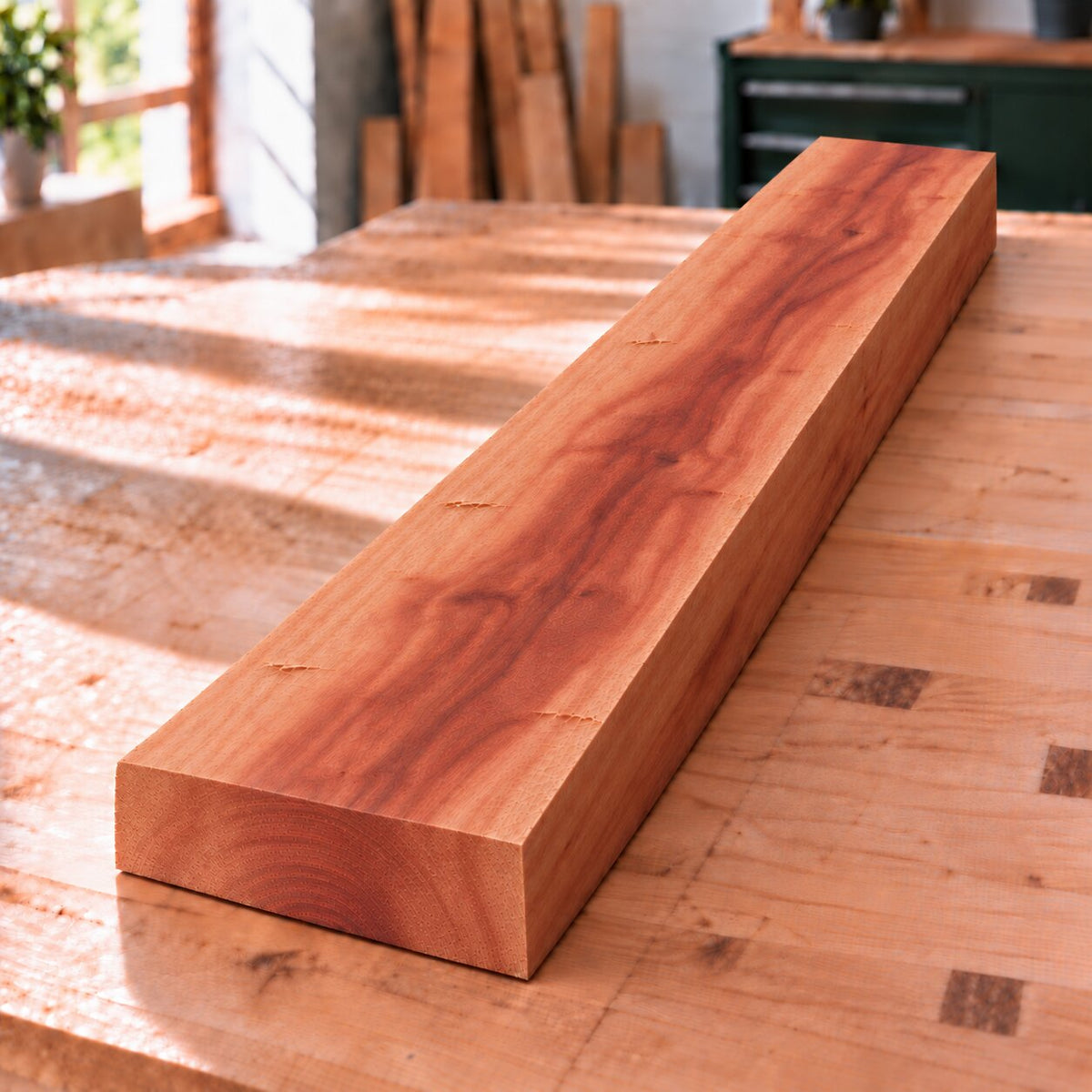 Rough-sawn solid apple wood board on a woodworking bench